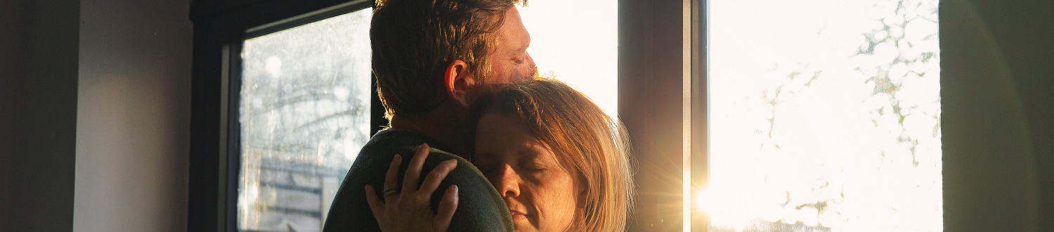 Two people hugging 