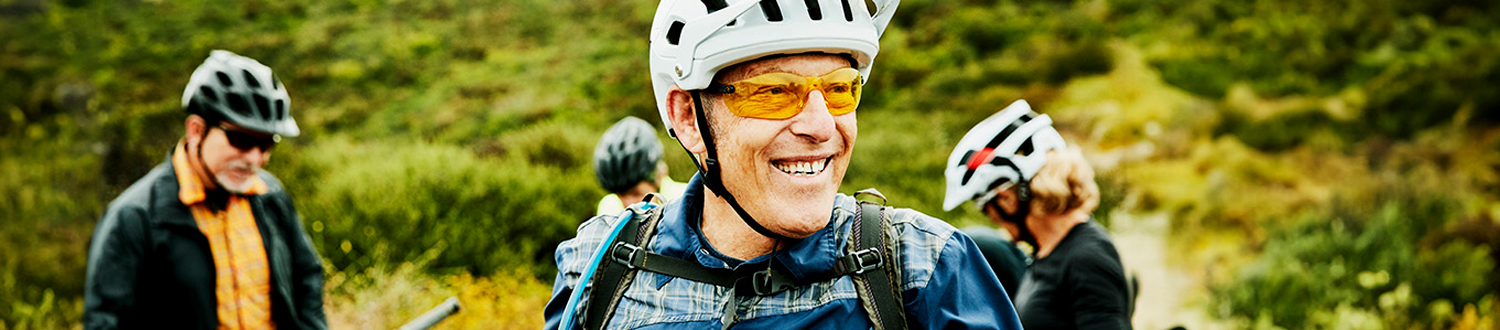 A person smiling wearing cycling clothes