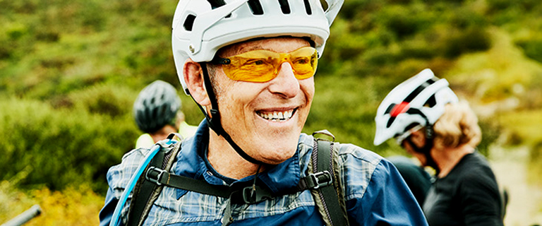 A person smiling wearing cycling clothes