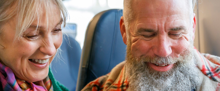 Happy couple on train