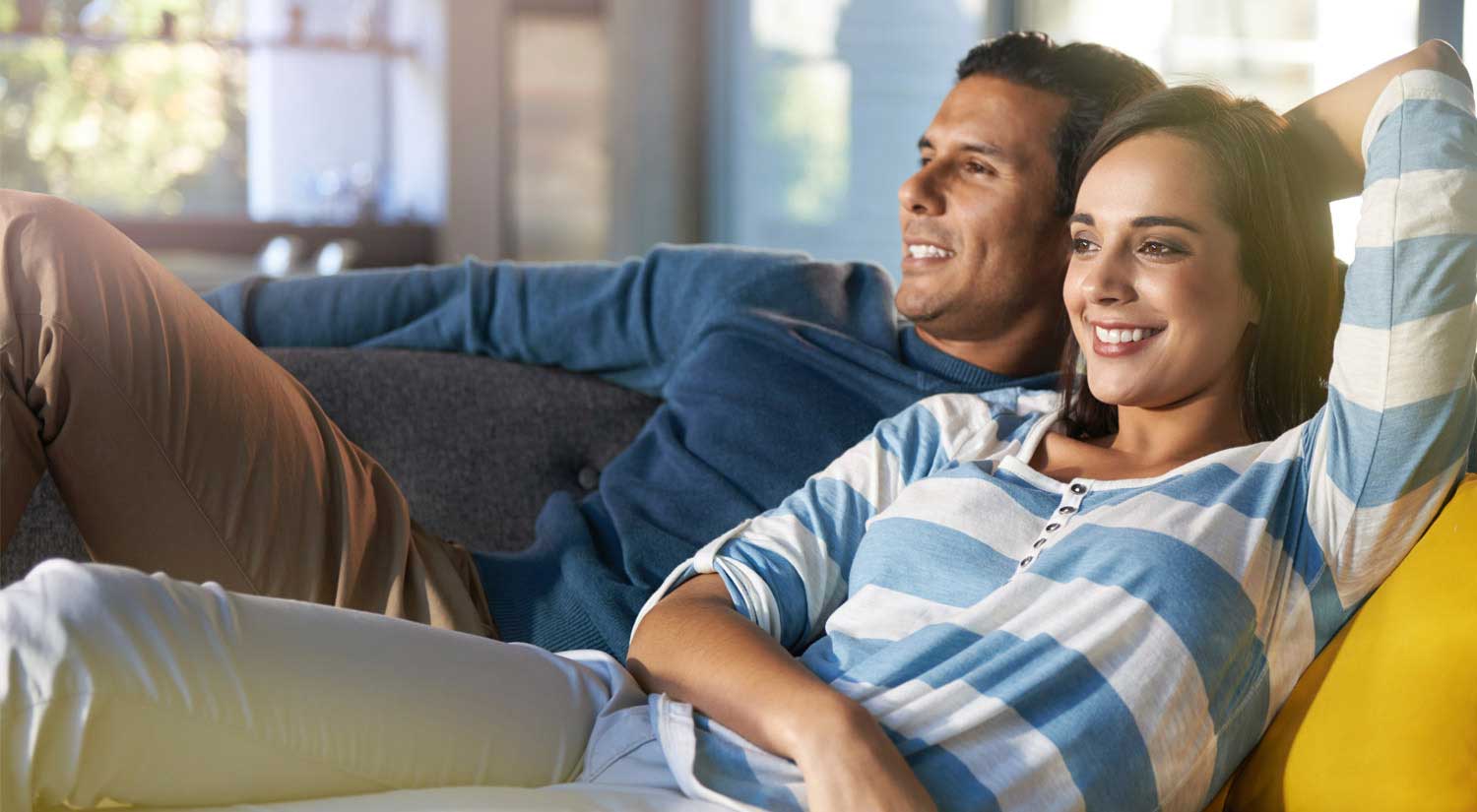 man and woman on sofa