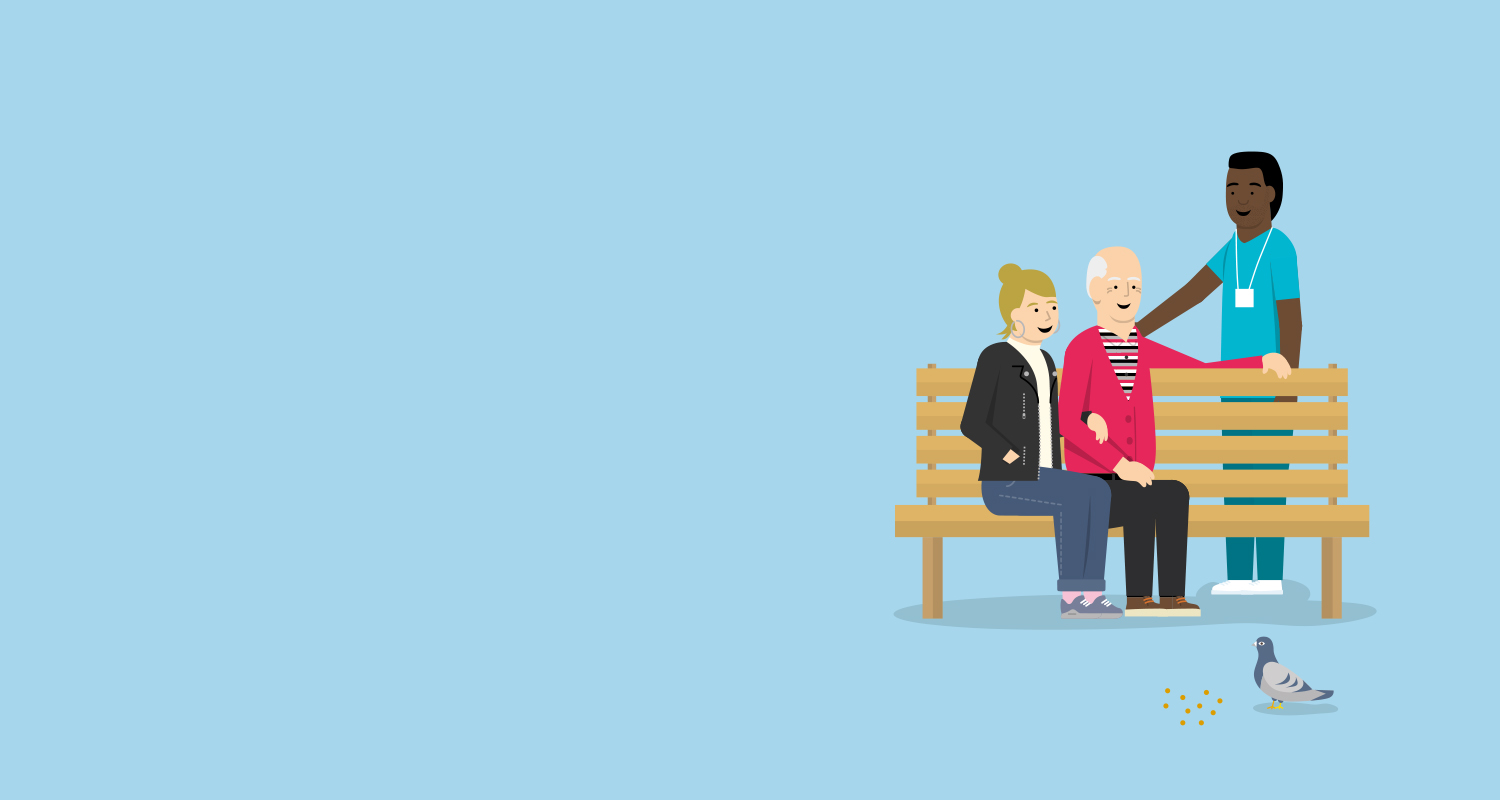 woman and older man sat on a park bench talking to a man stood up