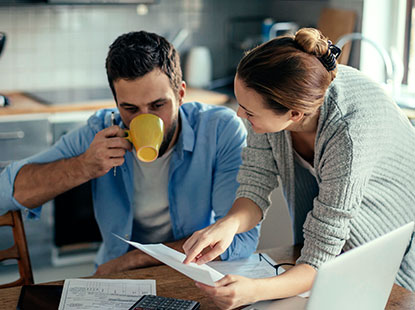 man and woman talking about paperwork