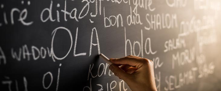 person writing on chalkboard