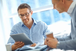 man looking at tablet