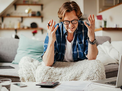 man frustrated with his finances