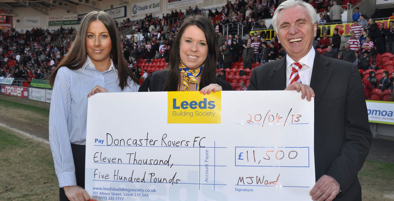 Leeds Building Society members presenting a cheque to Doncaster Rovers Football Club