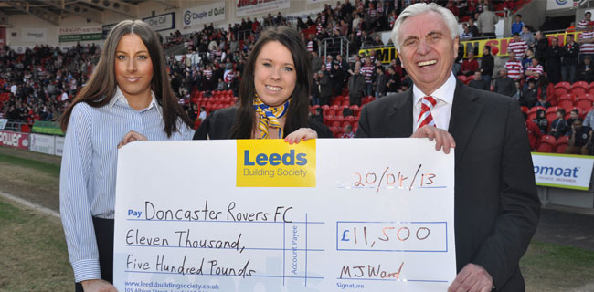 Leeds Building Society members presenting a cheque to Doncaster Rovers Football Club