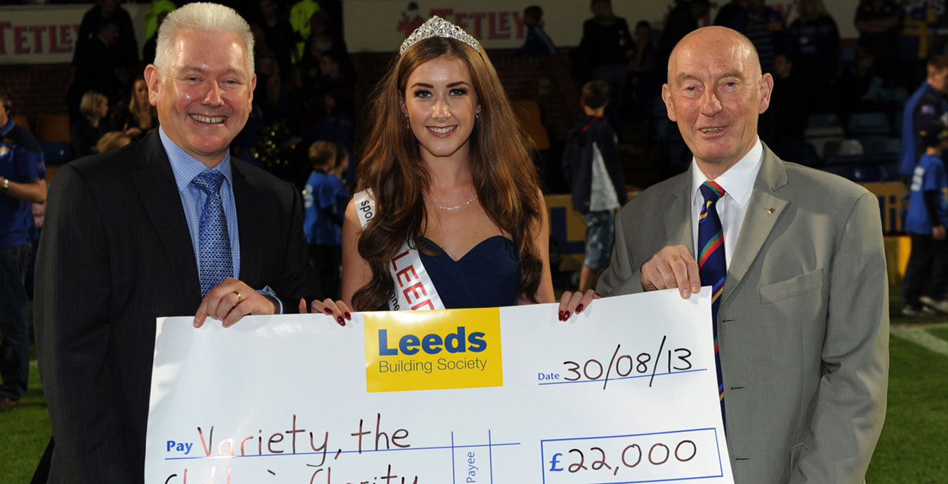 Miss Leeds and two members of Leeds Building Society with cheque