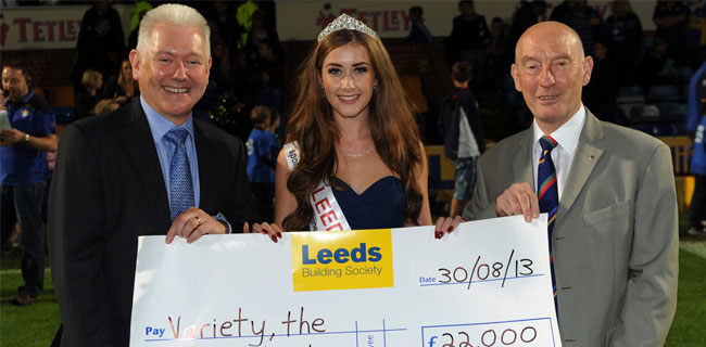 Miss Leeds and two members of Leeds Building Society with cheque