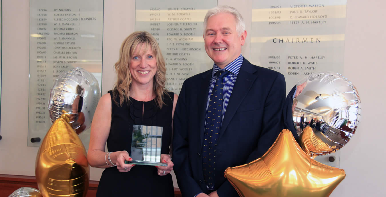 Cheryl Keeler being presented with her employee of the year award