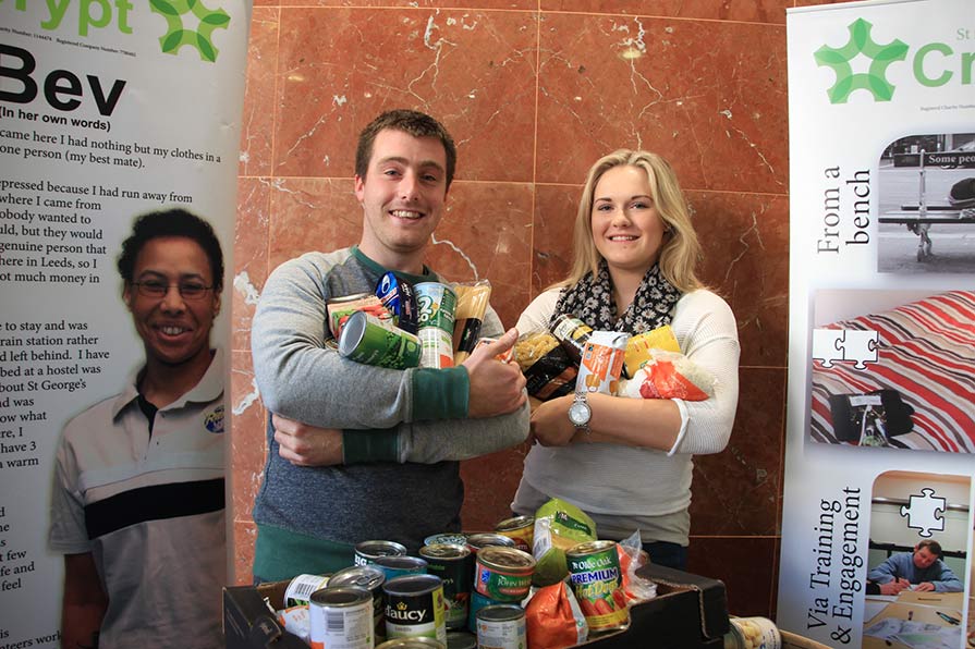Alfie Penfold and Ellen Hamilton from Leeds Building Society with some of the food donated by Head Office colleagues in Leeds.