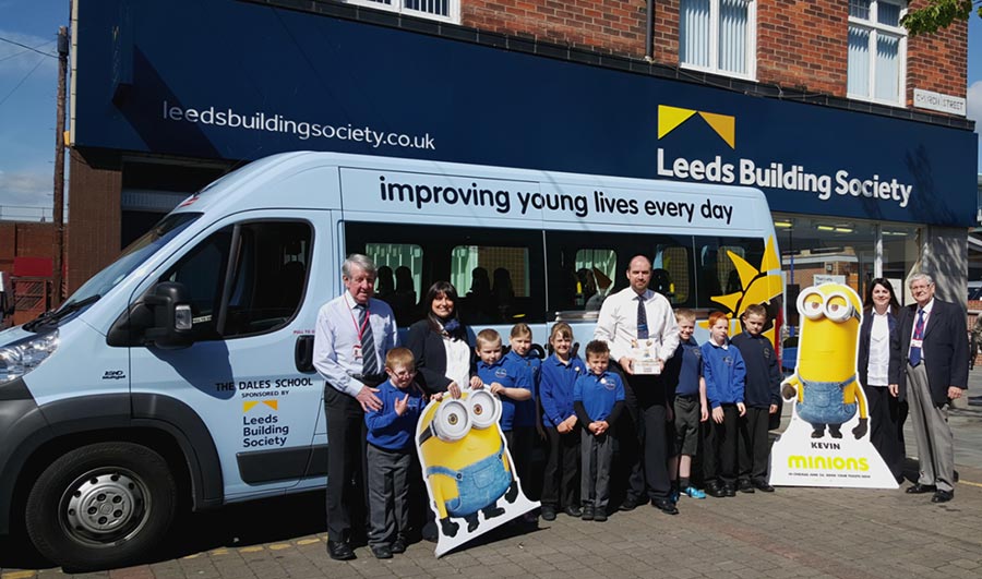 Pictured is Variety handing over the keys to a Sunshine Coach to Dales School in Blyth last year, thanks to Your Interest in Theirs and Caring Saver donations from Leeds Building Society.  