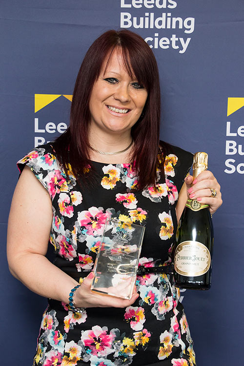 Alison is pictured with her 'Living our Values' award at the Annual Excellence in Action awards ceremony.   