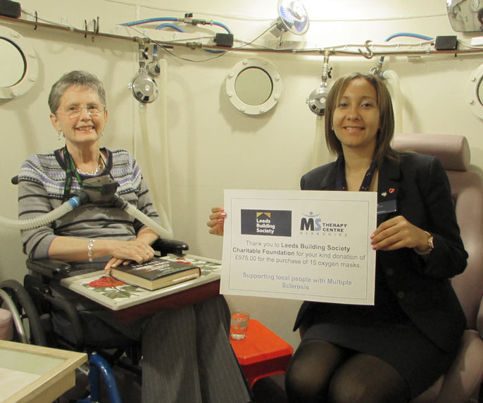 Cherie Beal is pictured (right) with Sue Smith (MS Member, left) at the Oxygen Chamber.
