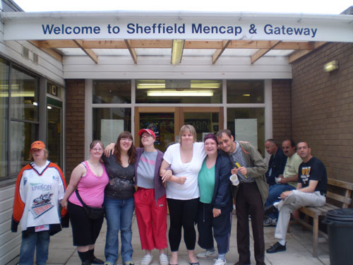 Colleagues being welcomed by Activity and Learning Hub members at Norfolk Lodge