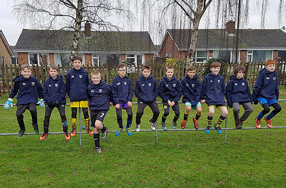 The team with their new hoodies