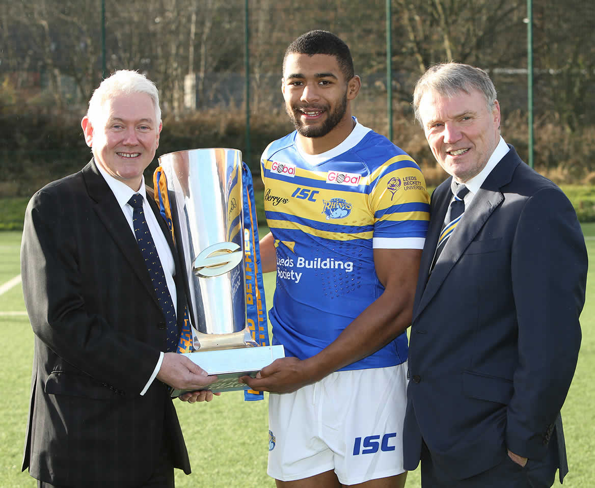 Peter Hill is pictured with the Super League trophy, Rhinos team captain Kallum Watkins and Gary Hetherington